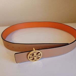 Tory Burch 1.5 inch reversible orange/tan belt with gold hardware.